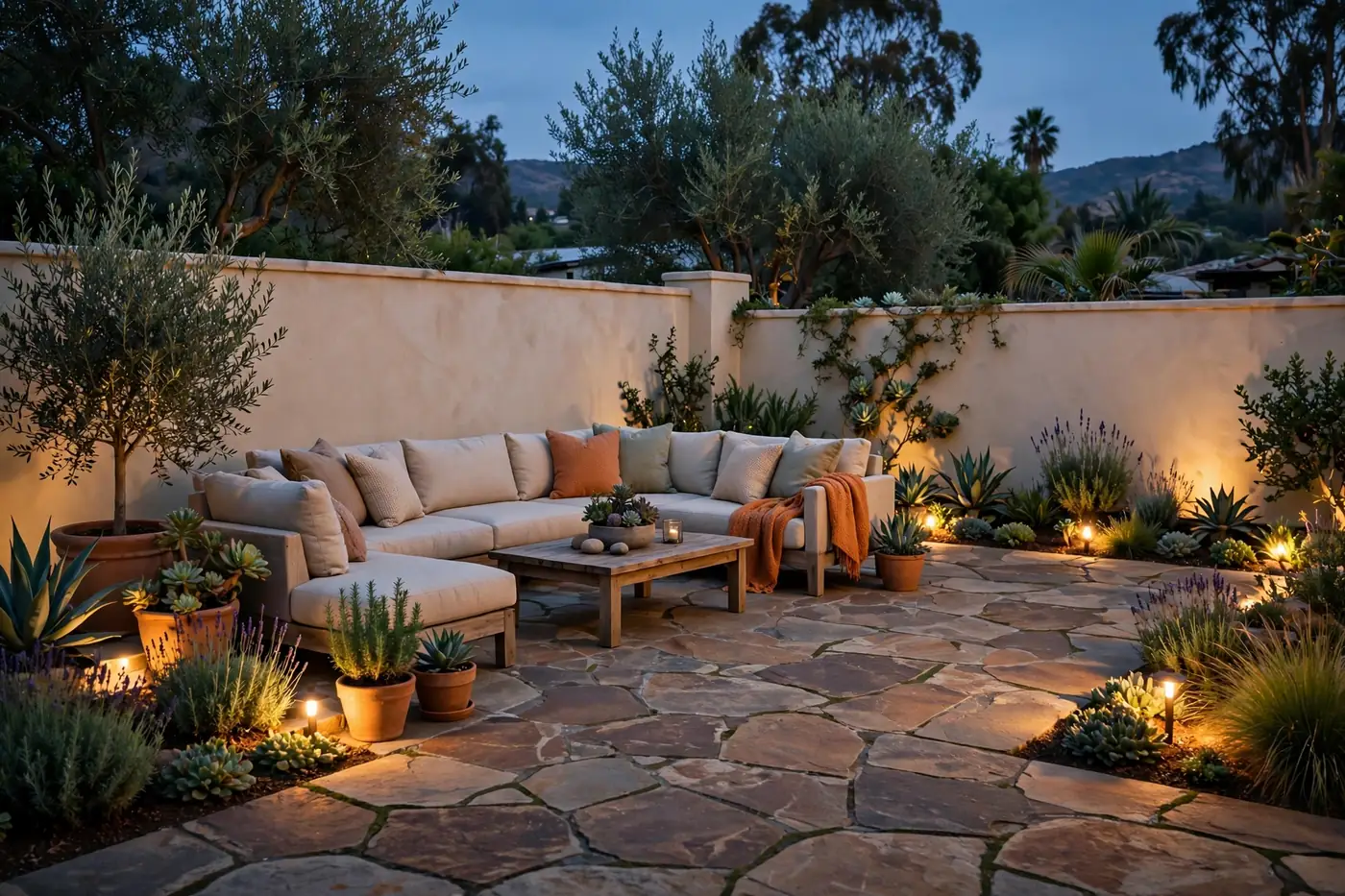A flagstone patio glowing with landscape lighting at dusk